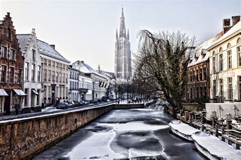 Winter time in Bruges. It was so cold the canals were frozen but the city was still a stunning ...