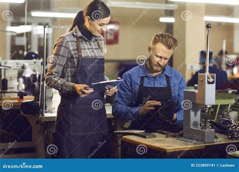 Two Shoe Factory Workers Checking the Quality of New Footwear at Manufacturing Workshop Stock ...