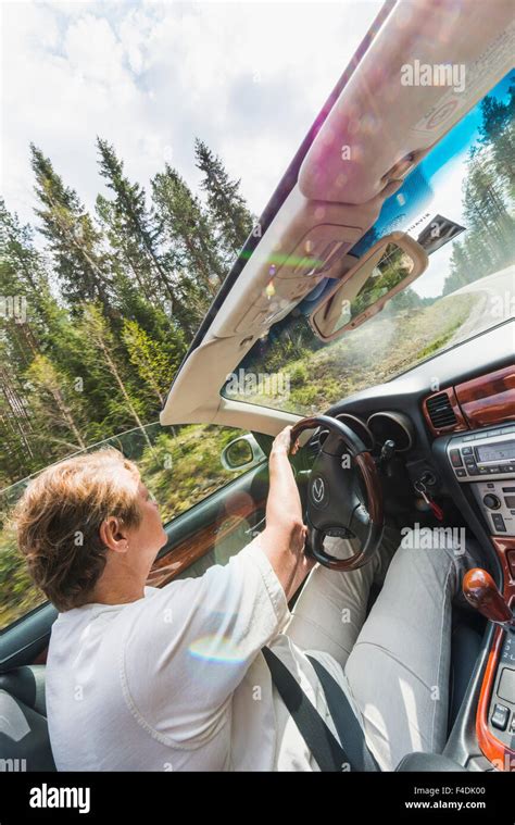 Woman driving convertible hi-res stock photography and images - Alamy