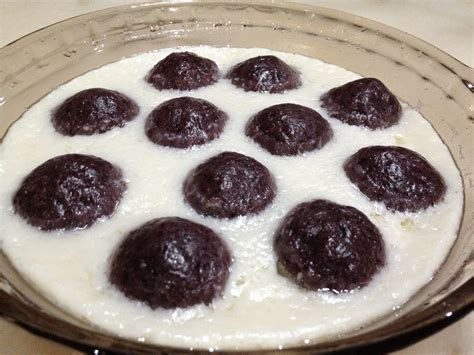 Malay traditional sweet dessert - black sticky rice flour dough filled with sweeten shaved ...