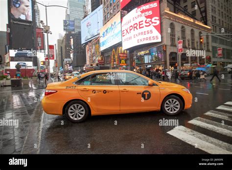 toyota camry hybrid new york yellow taxi cab crossing times square in ...