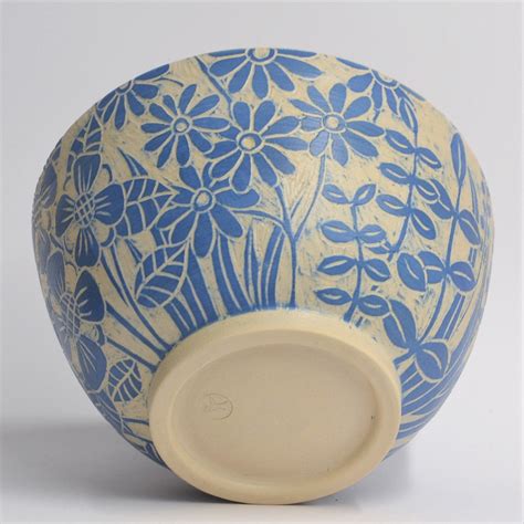 Handthrown bowl with sgraffito decoration of flowers and leaves in blue ...