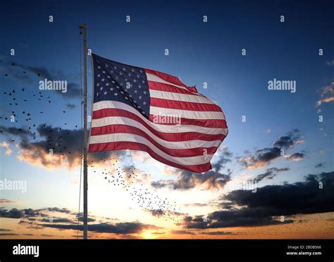 American Flag with Sunset in Background Stock Photo - Alamy