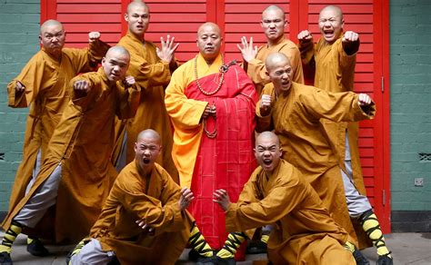 These Shaolin monks impressively meditate while hanging from their ...