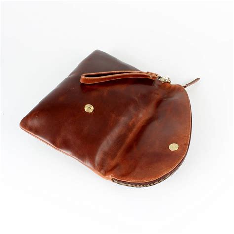 kirsti leather fold over clutch bag by the leather store | notonthehighstreet.com