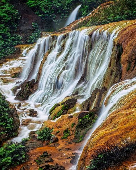 The Golden Waterfall is a waterfall in Ruifang District, New Taipei, Taiwan. The gold/copper ...