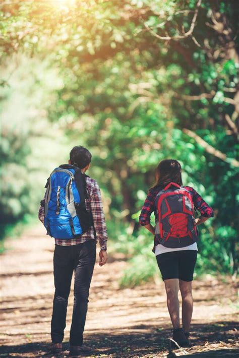 Rear of the couple hiking. Couple adventure travel. 3089788 Stock Photo ...