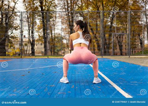 Athletic Girl Doing Squats with Resistance Bands. Stock Image - Image of workout, view: 234779461