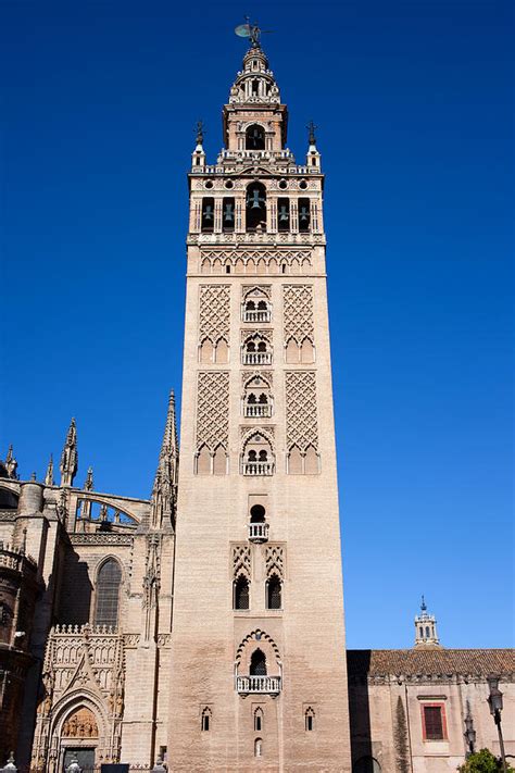 La Giralda Bell Tower In Seville Photograph by Artur Bogacki