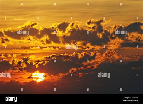 Sunset and Dramatic Clouds Stock Photo - Alamy