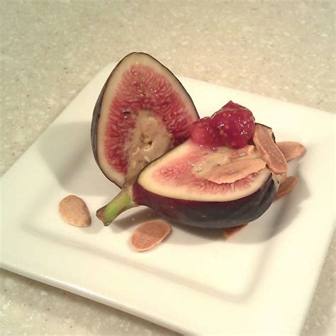 Fresh figs stuffed with black truffle foie gras mousse, garnished with toasted almond slivers ...