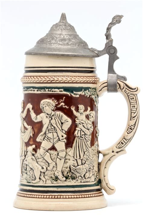 File:Faience beer stein with ball scene on brown background 02.jpg