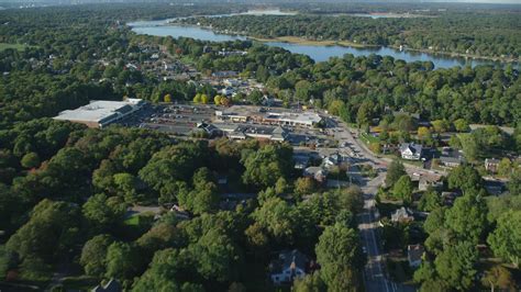 6k stock footage aerial video flying over County Road, approaching strip mall, Barrington, Rhode ...