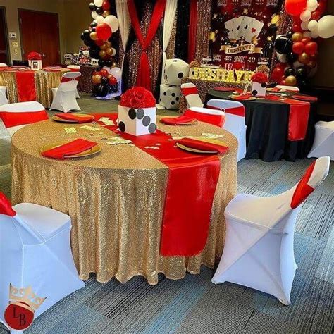 a banquet room decorated with red, white and gold decorations