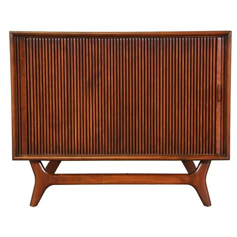 Mid-Century Tambour Door Cabinet with Sculptural Base at 1stdibs