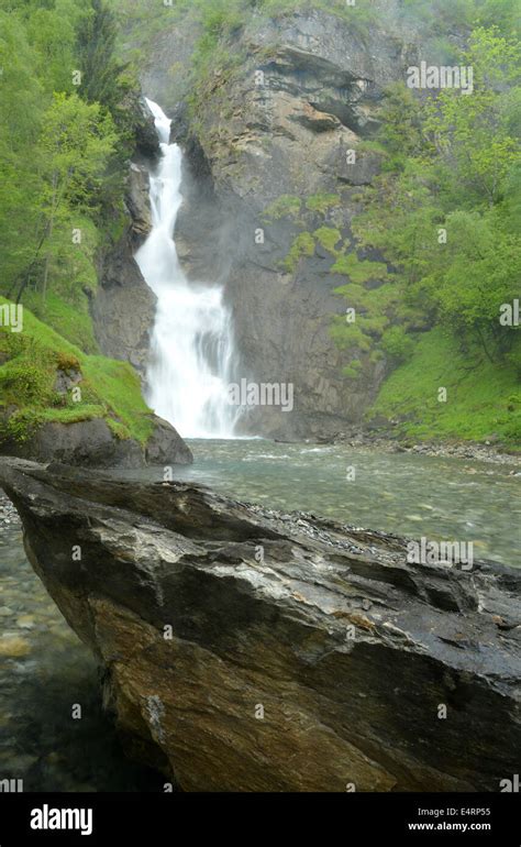 Waterfall splashes into a pool Stock Photo - Alamy