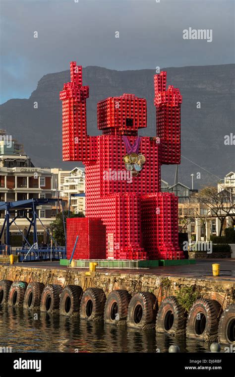 South Africa, Cape Town. "Lego Man" sculpture made of 4200 plastic Coca Cola crates Stock Photo ...