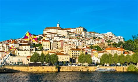 Premium Photo | Cityscape of coimbra above the mondego river in portugal