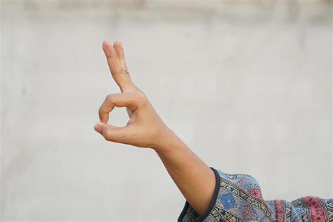 Woman doing hand gestures as a sign of ok 20202940 Stock Photo at Vecteezy