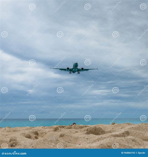 Plane Landing Flying Over Famous Maho Beach Stock Photo - Image of ...