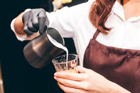 Premium Photo | Midsection of woman holding ice cream