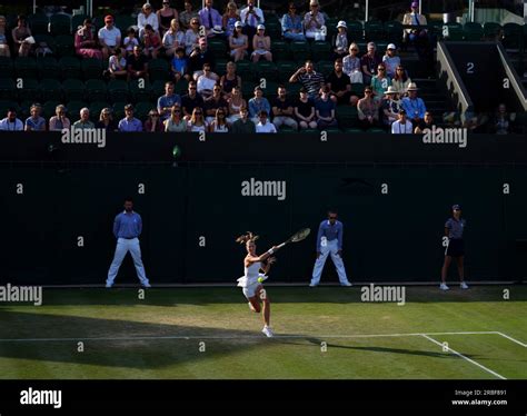 Hannah Klugman in action in the Girls singles on day seven of the 2023 Wimbledon Championships ...