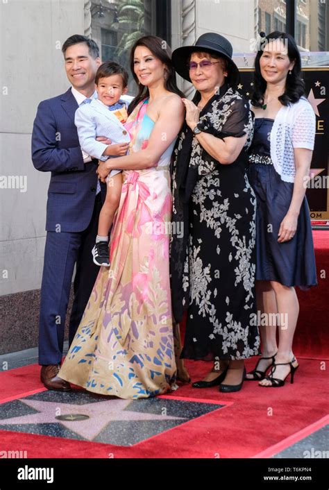 LUCY LIU and her family attend her star ceremony on the Hollywood Walk ...