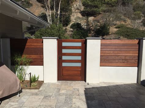 Custom Wood Gate by Garden Passages with Glass and Raised Panels | House gate design, Wood gate ...