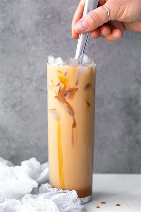 Make your own caramel iced coffee at home with this easy recipe. This sweet and creamy DIY ...