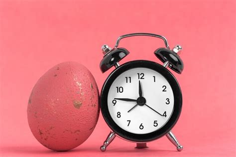 Premium Photo | Easter alarm clock with painted easter egg