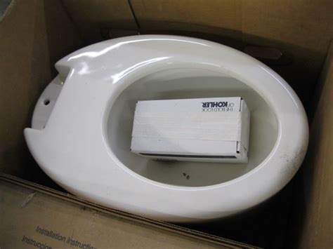 KOHLER TANKLESS TOILET, NEW IN BOX