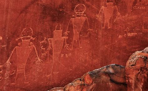 Capitol Reef petroglyphs – ancient etchings on rock walls – illustrate the lives of the Fremont ...