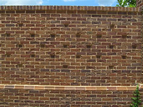 Even a wall should be anything but ordinary. This brick wall features a rowlock coping pattern ...