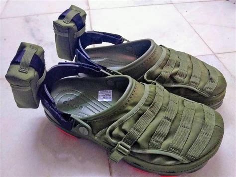 These military-styled Crocs are fitted with MOLLE Straps and a Storage Pocket To The Iconic Shoe ...