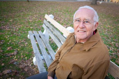 Old Man Sitting on Bench stock image. Image of elderly - 28039525