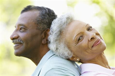 Portrait Of Romantic Senior African American Couple In Park - Warner Orthopedics