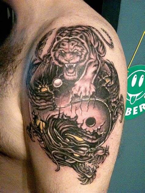 Tiger and Dragon Yin Yang Tattoo On Left shoulder | Dragon and tiger yin yang tattoo, Tiger ...