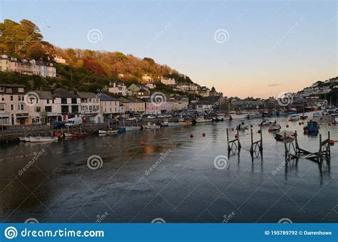 Looe Harbour at sunset editorial photography. Image of fishing - 195789792