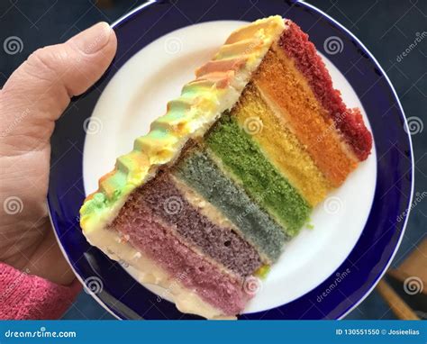 Slice of rainbow cake stock photo. Image of arts, angle - 130551550