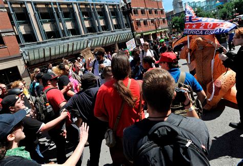 38 photos of the 'Straight Pride Parade' and counter-protests in Boston