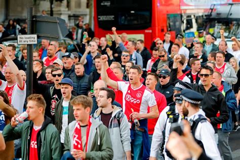 Ajax fans march through London and take over Leicester Square ahead of ...