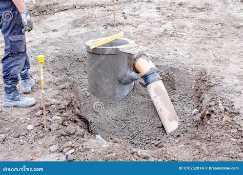 Groundworkers Installing New Road Gully during New Road Construction Stock Photo - Image of line ...