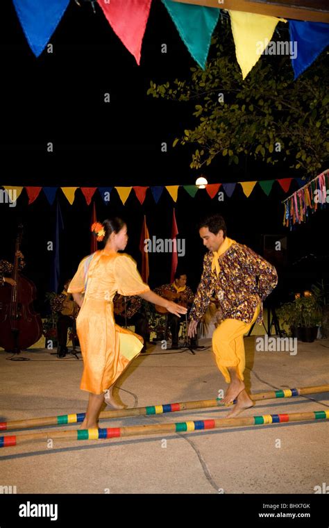 Filipino dancers doing traditional folk dance called "tinikling Stock Photo - Alamy