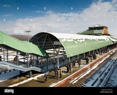 India, Kashmir, Srinagar Railway station in winter, passengers waiting ...