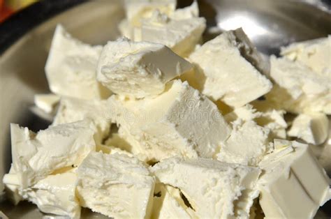 Sour Milk Cheese is Cut into Pieces Lying on a Platter. Stock Photo ...