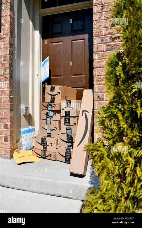 Amazon Prime boxes delivered and stacked at the front door of a ...