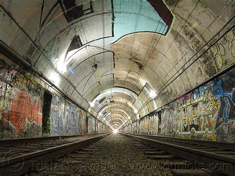 muni train tunnel with graffiti, san francisco
