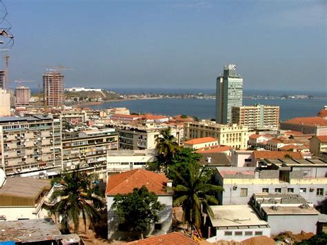 a city with lots of tall buildings next to the ocean