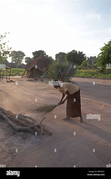 Woman sweeping africa hi-res stock photography and images - Alamy