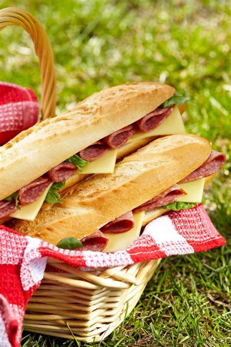 Long Baguette Sandwiches with Salami and Cheese Stock Photo - Image of grass, food: 30916036